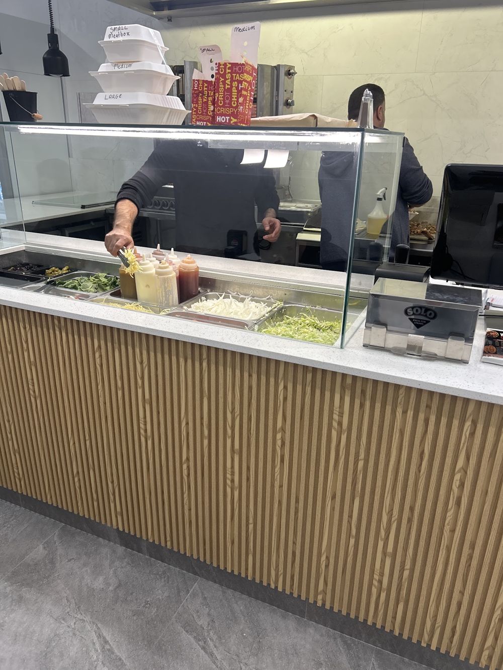 Inside Woodvale Kebabs & Bakery: the counter